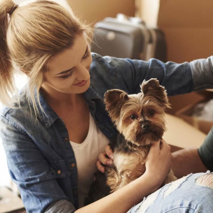 two people with a dog moving at smyrna ga apartments